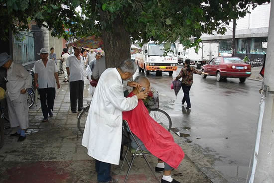 A street barber in Changchun. Picture taken Aug 10, 2005 by Pubert
