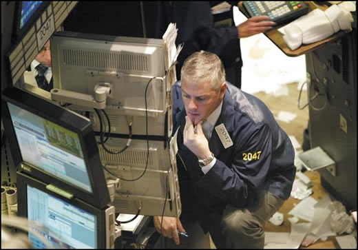 A Floor Trader checking market prices (Floor trader at the New York Stock Exchange)